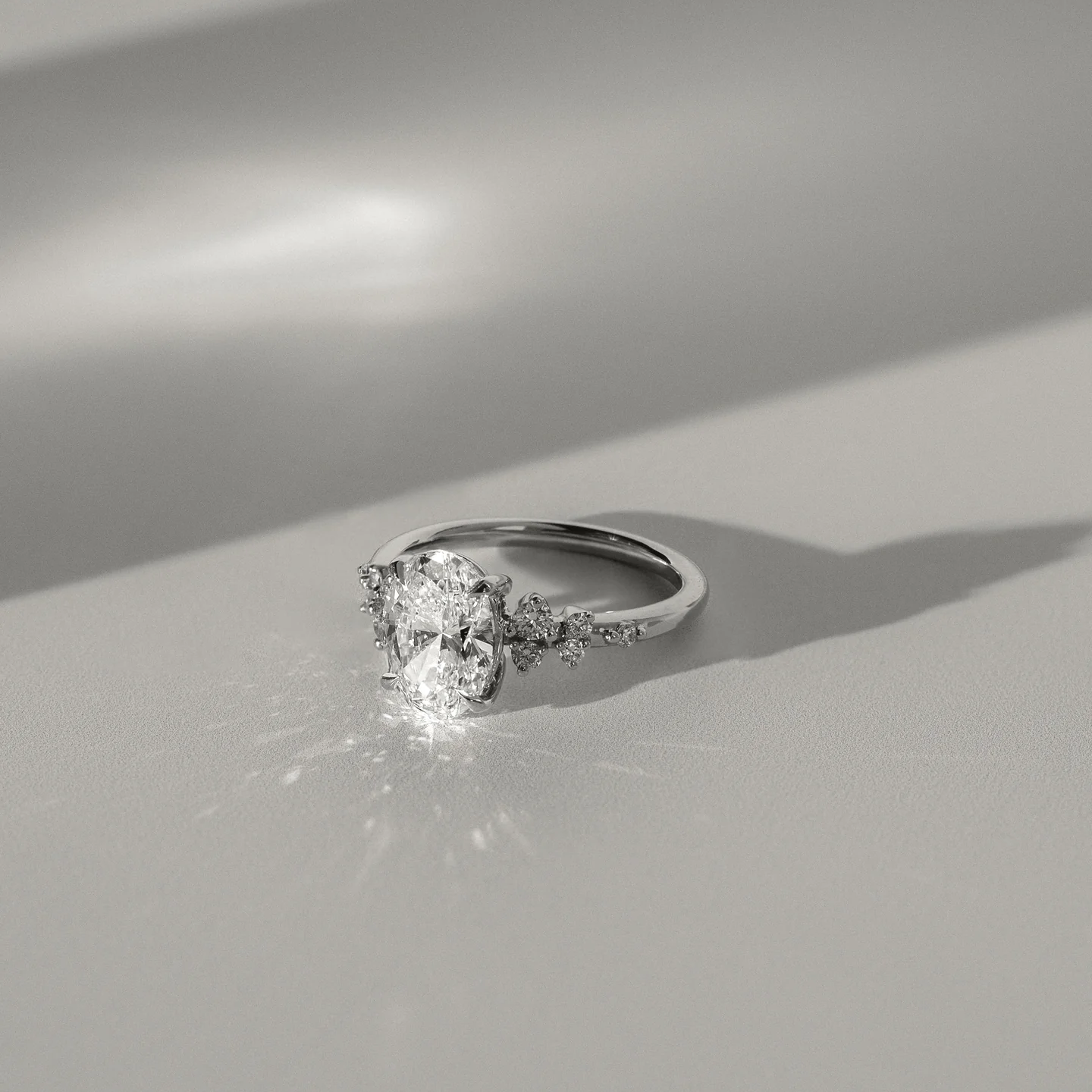 4.53 Ct Oval Cut White Diamond Ring with Side Clusters | F Color VS1 | 925 Silver with 14K Gold Plating